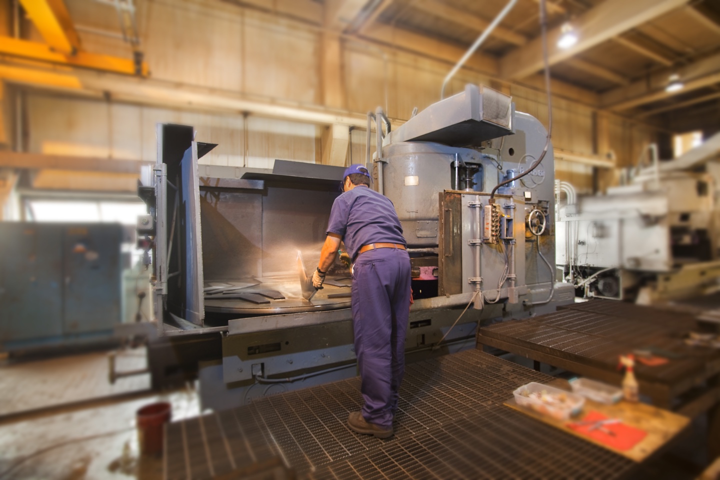 Blanchard grinder processing a large steel plate